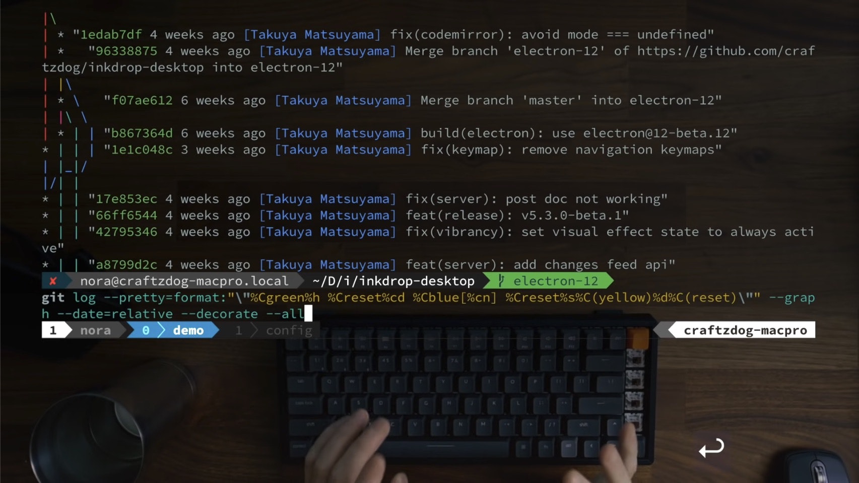 Screenshot from devaslife video: My Fish shell workflow for coding. You can see him typing on the keyboard, and the table itself is the background of the terminal