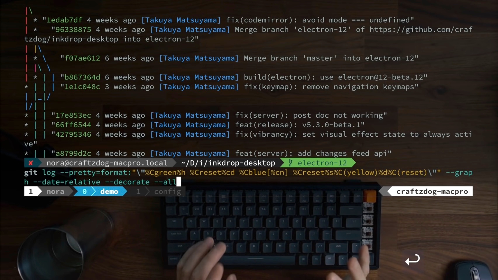 Screenshot from devaslife video: My Fish shell workflow for coding. You can see him typing on the keyboard, and the table itself is the background of the terminal